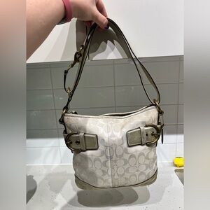 Authentic Coach metallic gold leather trim w/ extendable strap, monogram